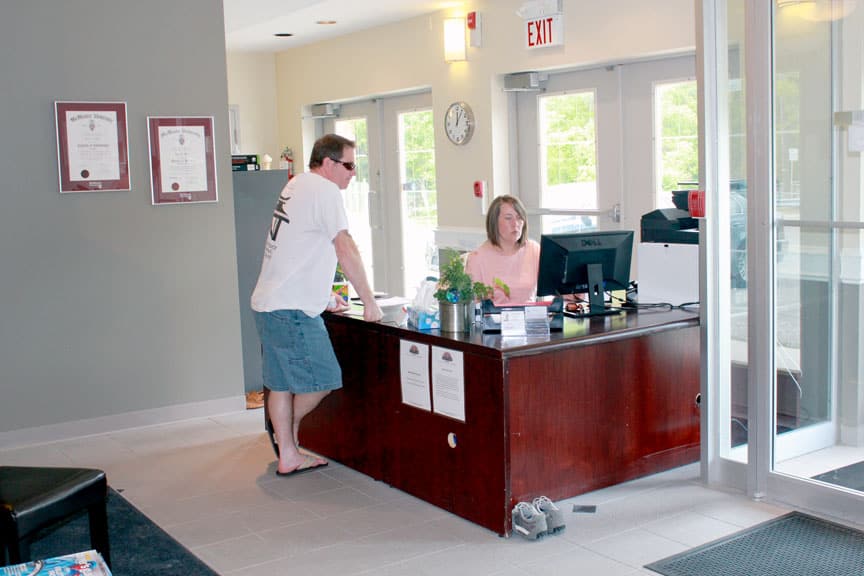 Tammy greeting patients at reception