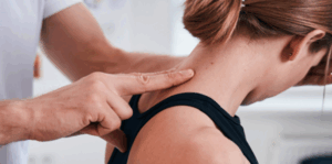 A physiotherapist assisting a skier with injury prevention techniques during winter sports training at South Simcoe Physio.