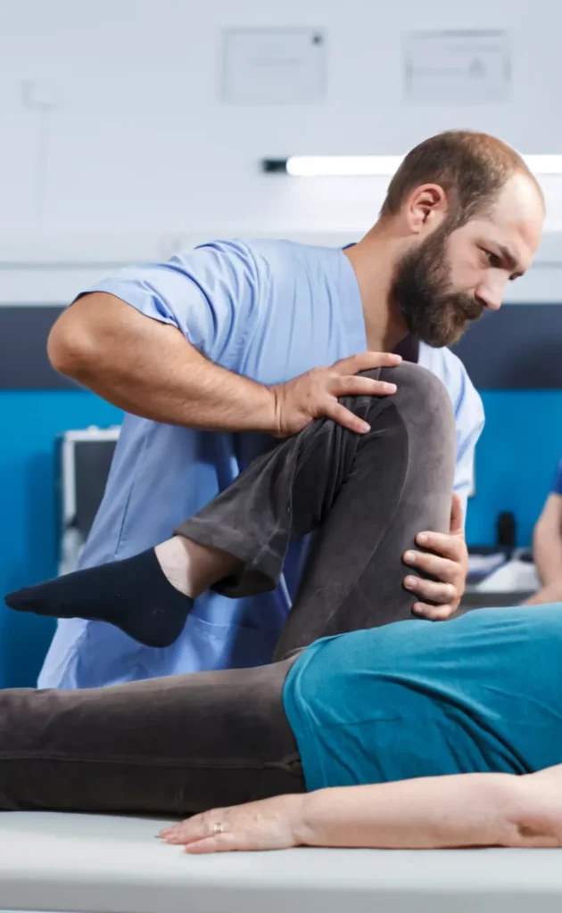 Sports Physiotherapy Assessment – Knee Mobility Physiotherapist assessing knee mobility